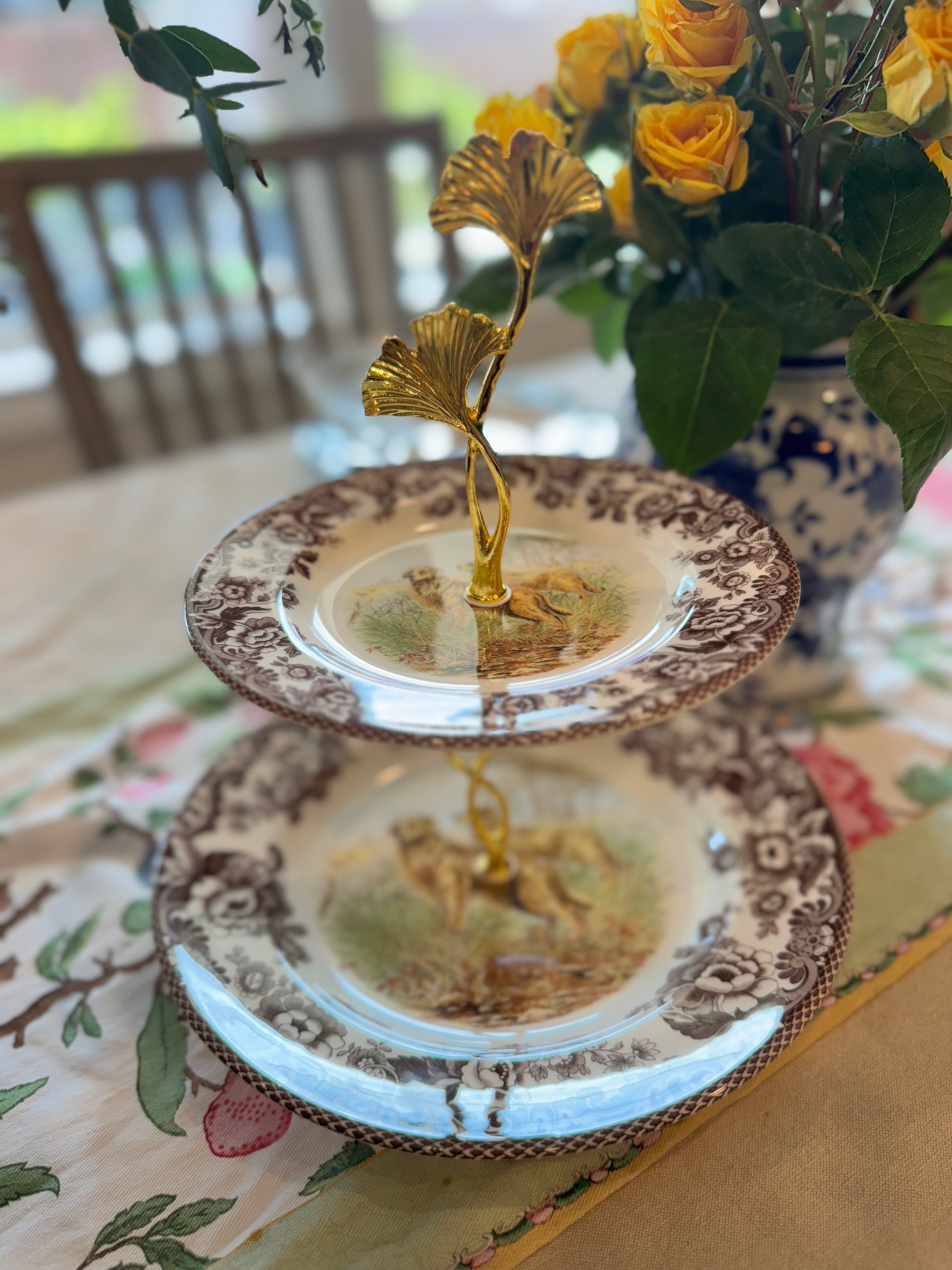 Two-tier stand made from Spode Woodland plates with a Golden Retriever hunting scene and floral borders.