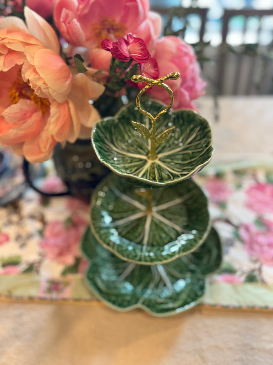 Three-tiered stand with Bordallo Pinheiro green cabbage leaf plates and a decorative gold leaf handle, perfect for hosting and statement displays.