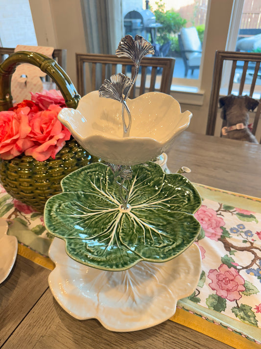 Three-tier stand with cream cabbage charger base, green cabbage dinner plate, and cream bowl top, featuring a ginkgo leaf handle for an elegant, nature-inspired design.
