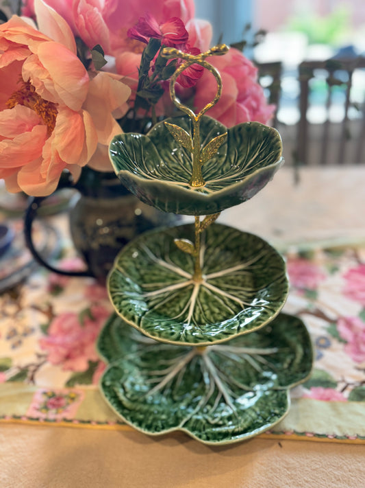 Three-tiered stand with Bordallo Pinheiro green cabbage leaf plates and a decorative gold leaf handle, perfect for hosting and statement displays.