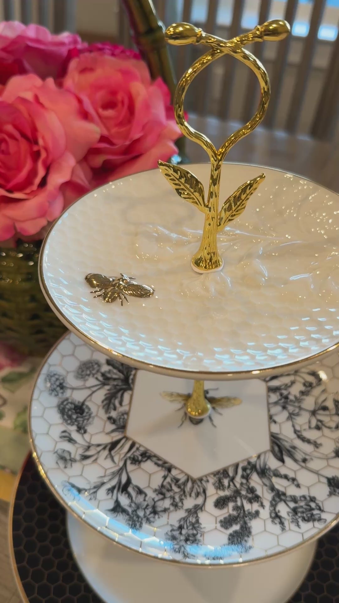 Three-tier stand made from Williams Sonoma Beehive collection plates with honeycomb, botanical, and bee designs, accented with gold hardware – perfect for hosting and entertaining.